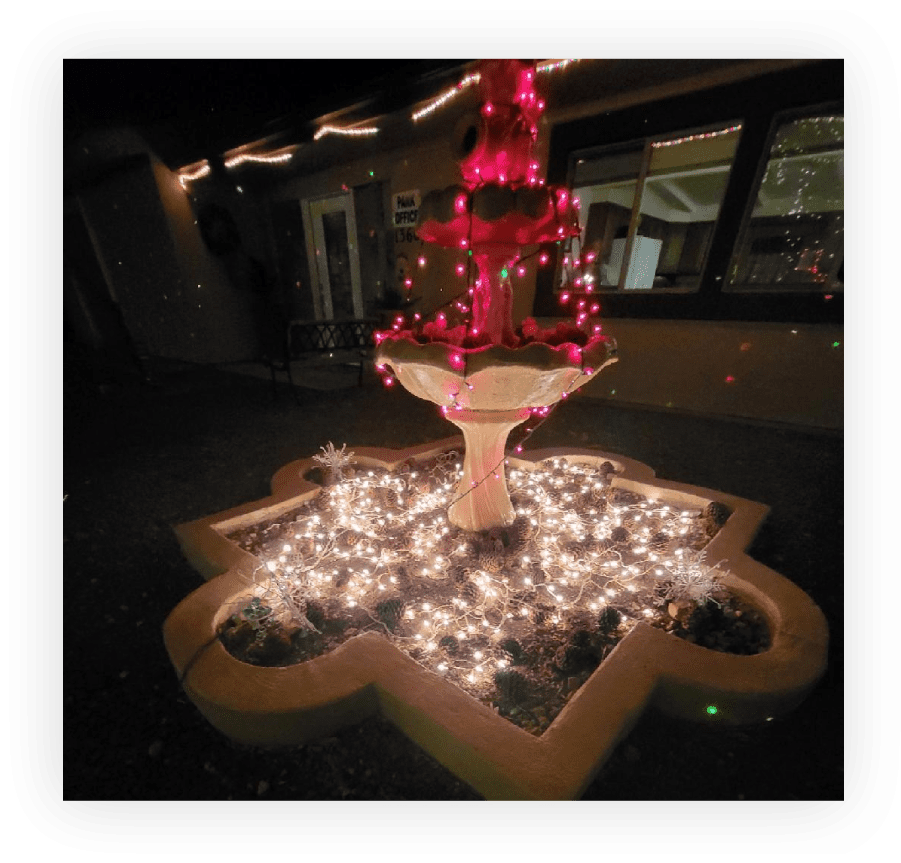 A fountain with lights in the middle of it.